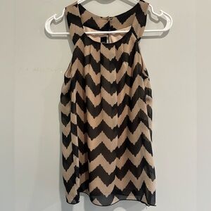Black / nude sleeveless blouse.